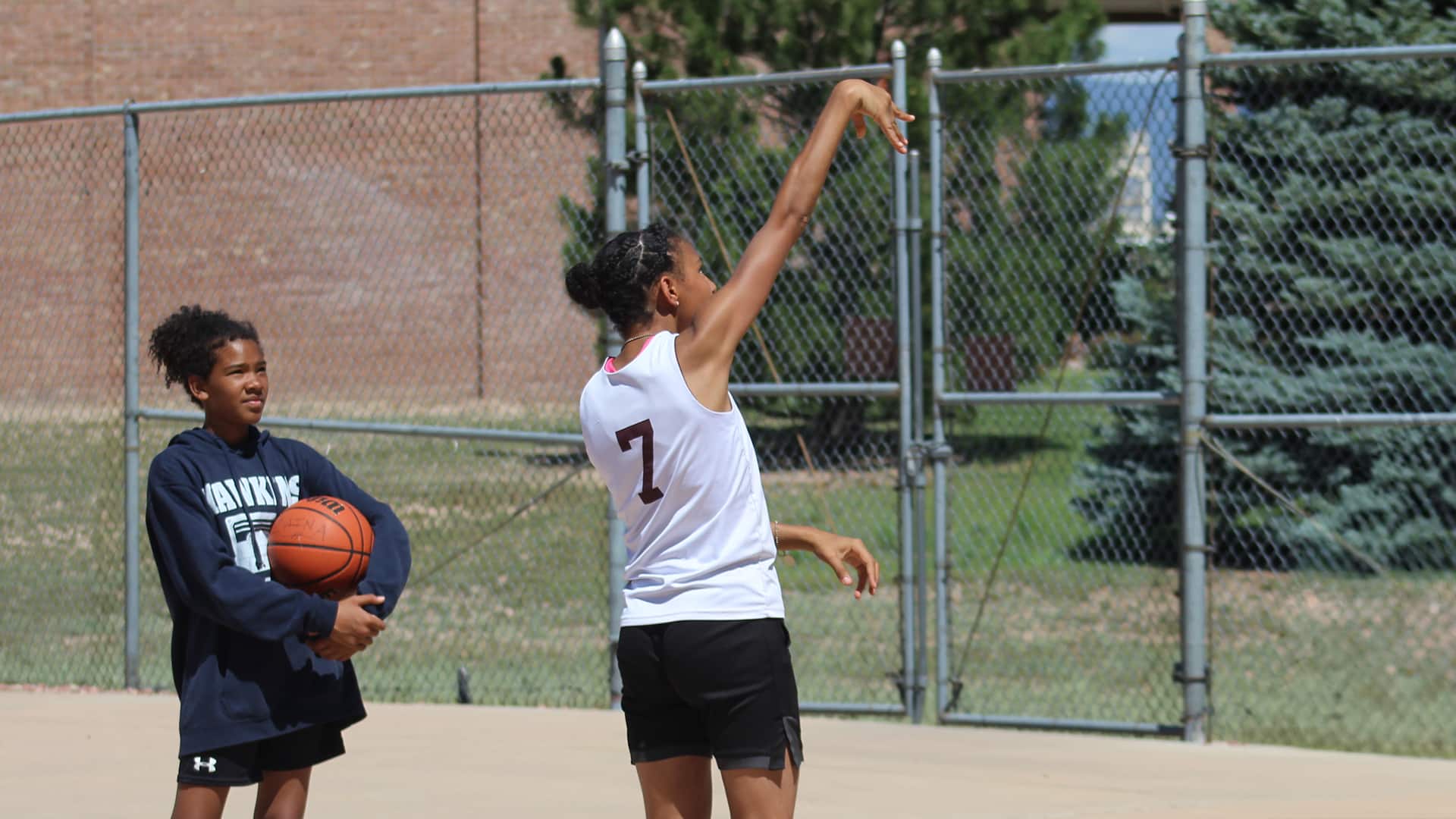 Youth playing basketball at Peterson SFB